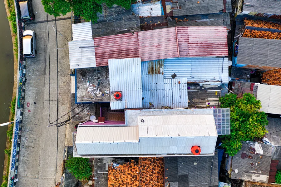 Drone flying above a roof for an aerial inspection